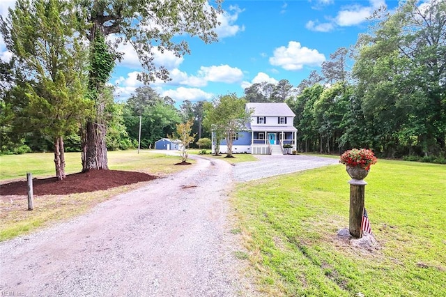 3502 Goodwin Neck Rd, Yorktown, VA 23692 - view of front of house featuring gravel driveway, covered porch, and a front yard