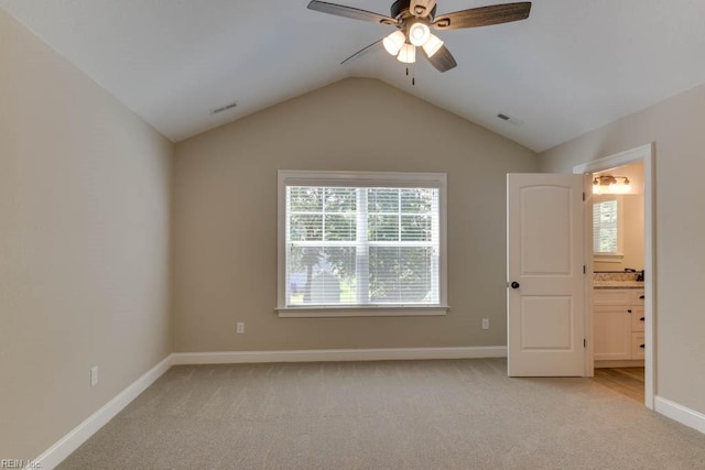 312 Bank St, Suffolk, VA 23434 - unfurnished bedroom featuring light carpet, lofted ceiling, baseboards, connected bathroom, and ceiling fan