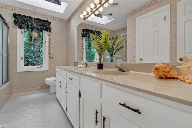 928 S Spigel Dr, Virginia Beach, VA 23454 - full bath with a skylight, a shower with door, vanity, tile patterned floors, and wallpapered walls