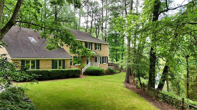 928 S Spigel Dr, Virginia Beach, VA 23454 - colonial house featuring a front yard, brick siding, and a shingled roof