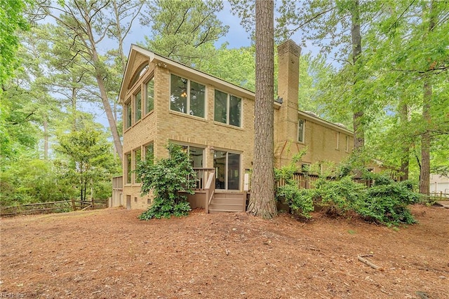 928 S Spigel Dr, Virginia Beach, VA 23454 - back of property featuring a chimney, a wooden deck, and brick siding