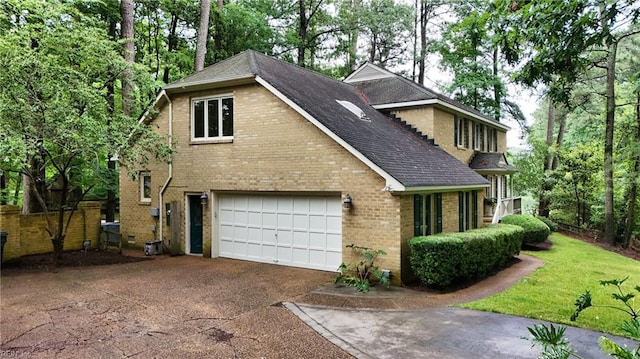 928 S Spigel Dr, Virginia Beach, VA 23454 - view of front of property with driveway, a shingled roof, brick siding, and an attached garage