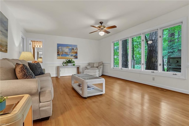 928 S Spigel Dr, Virginia Beach, VA 23454 - living area with a ceiling fan, light wood finished floors, and a wainscoted wall