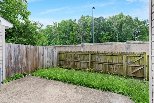 10 Musket Ln, Hampton, VA 23666 - fenced backyard featuring a patio