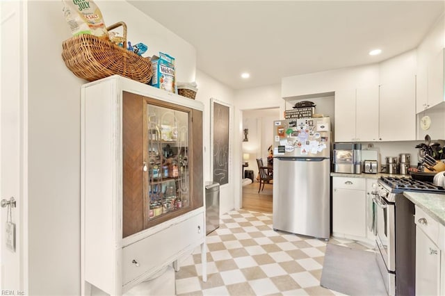 1301 Penguin Cir, Virginia Beach, VA 23451 - kitchen featuring stainless steel appliances, light floors, white cabinets, light countertops, and recessed lighting