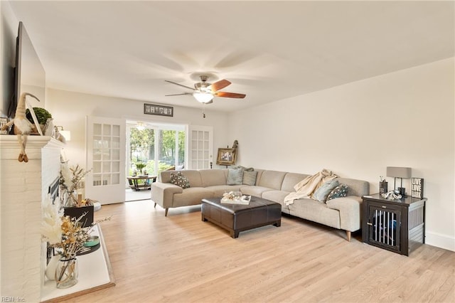 1301 Penguin Cir, Virginia Beach, VA 23451 - living area with ceiling fan, light wood-style flooring, and a brick fireplace