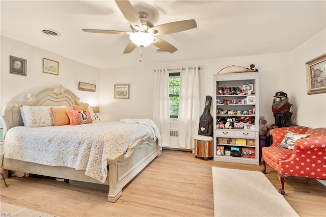1301 Penguin Cir, Virginia Beach, VA 23451 - bedroom featuring light wood finished floors, a ceiling fan, and radiator