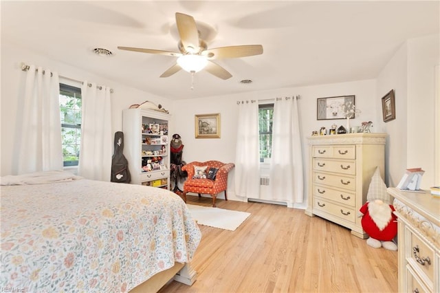 1301 Penguin Cir, Virginia Beach, VA 23451 - bedroom with multiple windows, light wood finished floors, and ceiling fan