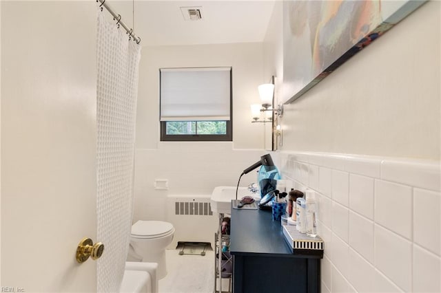 1301 Penguin Cir, Virginia Beach, VA 23451 - full bath with radiator, tile walls, curtained shower, and a wainscoted wall