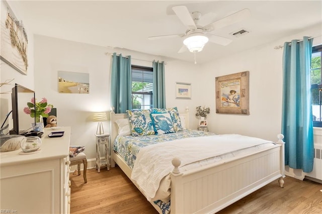 1301 Penguin Cir, Virginia Beach, VA 23451 - bedroom featuring light wood-style flooring, multiple windows, and a ceiling fan