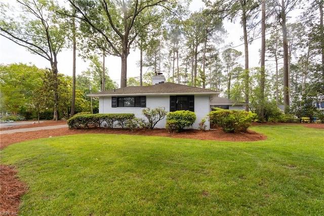 1301 Penguin Cir, Virginia Beach, VA 23451 - view of front facade with a front lawn and a chimney