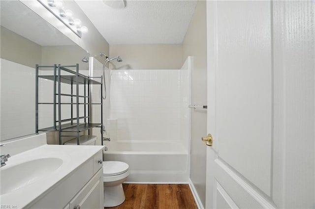 2459 Old Greenbrier Rd Unit 121, Chesapeake, VA 23325 - bathroom with wood finished floors, vanity, toilet, shower / bathtub combination, and a textured ceiling