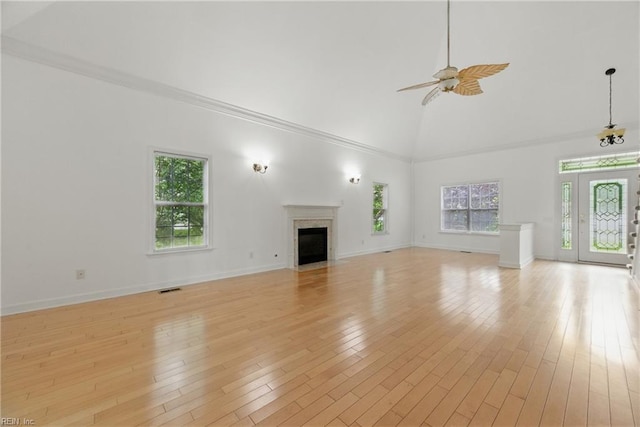 5308 Doral Woods Ct, Suffolk, VA 23435 - unfurnished living room with high vaulted ceiling, healthy amount of natural light, ceiling fan, a fireplace with flush hearth, and light wood-type flooring