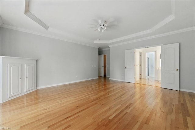 5308 Doral Woods Ct, Suffolk, VA 23435 - unfurnished bedroom featuring light wood-type flooring, a raised ceiling, baseboards, ornamental molding, and a ceiling fan