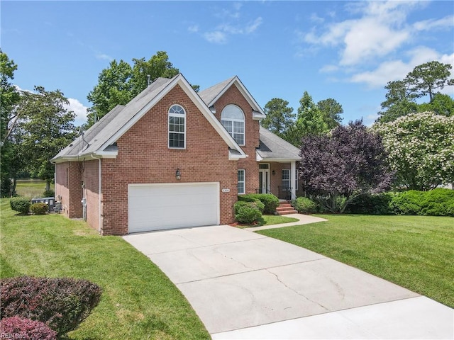5308 Doral Woods Ct, Suffolk, VA 23435 - traditional-style house with a garage, brick siding, concrete driveway, and a front yard