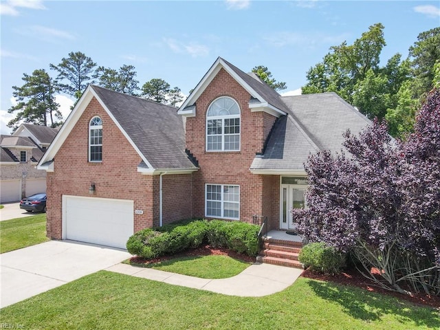 5308 Doral Woods Ct, Suffolk, VA 23435 - traditional-style home with an attached garage, a front lawn, and brick siding