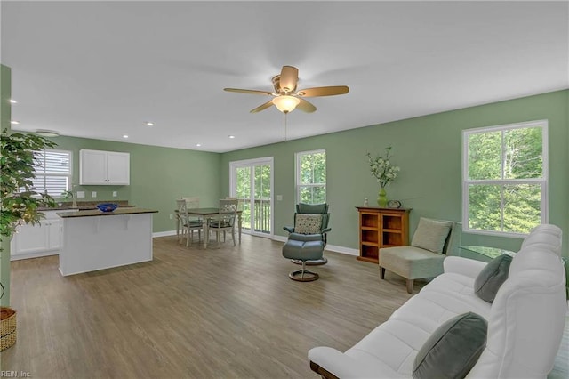 6945 Healy Ave, Gloucester, VA 23061 - living room featuring ceiling fan, plenty of natural light, light wood finished floors, baseboards, and recessed lighting