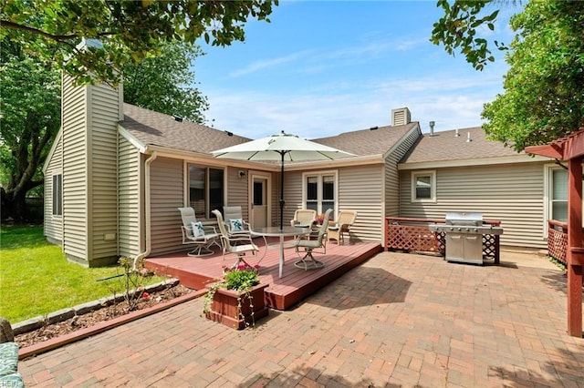 2004 Convoy Ct, Virginia Beach, VA 23454 - rear view of house featuring a chimney, a deck, a patio area, and a lawn