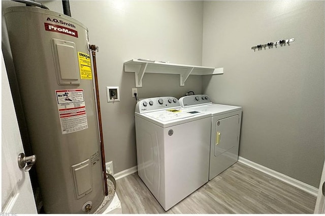 932 Southmoor Dr Unit 105, Virginia Beach, VA 23455 - laundry area featuring water heater, separate washer and dryer, light wood-style floors, and baseboards