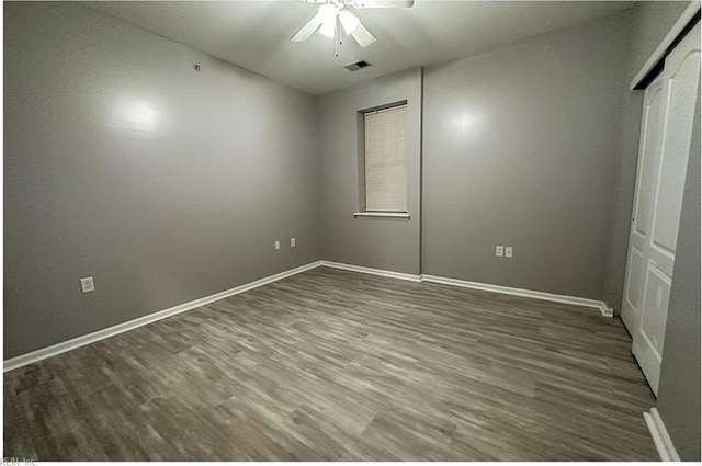932 Southmoor Dr Unit 105, Virginia Beach, VA 23455 - unfurnished bedroom featuring wood finished floors, baseboards, and a ceiling fan
