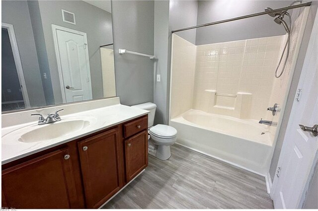 932 Southmoor Dr Unit 105, Virginia Beach, VA 23455 - bathroom featuring vanity, toilet, shower / washtub combination, and wood finished floors