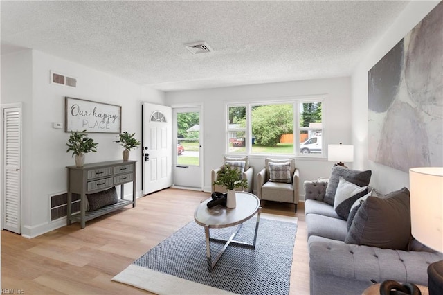 3421 Stancil St, Virginia Beach, VA 23452 - living area featuring light wood finished floors and a textured ceiling