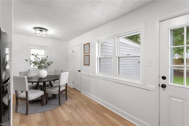 3421 Stancil St, Virginia Beach, VA 23452 - dining space with a textured ceiling, light wood-type flooring, plenty of natural light, and baseboards