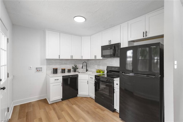 3421 Stancil St, Virginia Beach, VA 23452 - kitchen featuring black appliances, a sink, light countertops, white cabinetry, and a textured ceiling