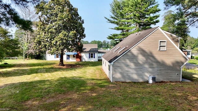 123 Orchard Cove Ln, Callao, VA 22435 - view of side of home with a lawn and central AC unit
