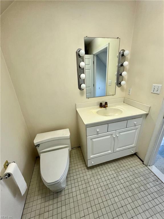123 Orchard Cove Ln, Callao, VA 22435 - half bathroom with tile patterned flooring, toilet, and vanity