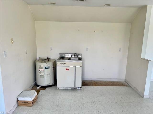 123 Orchard Cove Ln, Callao, VA 22435 - kitchen featuring electric water heater, light floors, and baseboards