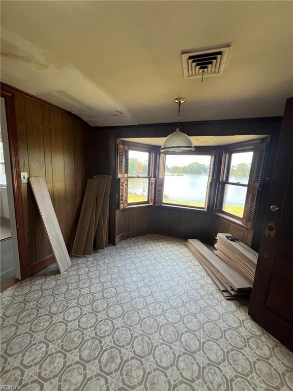 123 Orchard Cove Ln, Callao, VA 22435 - unfurnished dining area featuring wood walls