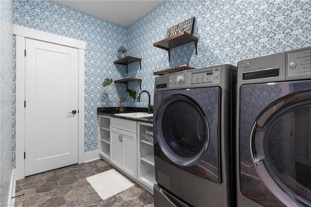 2701 Ashbys Bridge Ct, Virginia Beach, VA 23456 - washroom featuring washer and dryer, wallpapered walls, and cabinet space