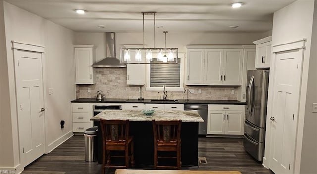 1170 Hitchens Ln, Williamsburg, VA 23188 - kitchen with wall chimney range hood, appliances with stainless steel finishes, a sink, dark wood-type flooring, and white cabinets