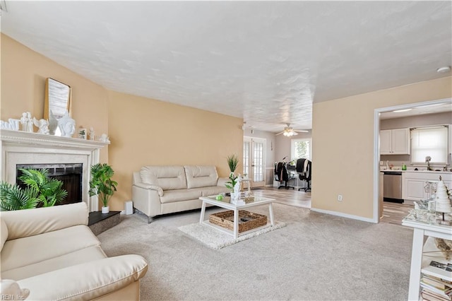 5425 Sweetwater Ct, Virginia Beach, VA 23462 - living room featuring light carpet, a fireplace, and a ceiling fan