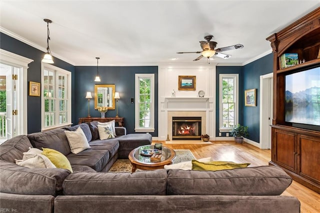 107 Gullane, Williamsburg, VA 23188 - living area featuring light wood-style flooring, plenty of natural light, ceiling fan, a large fireplace, and crown molding