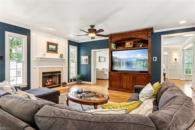 107 Gullane, Williamsburg, VA 23188 - living room with crown molding, light wood-style floors, ceiling fan, baseboards, and a fireplace
