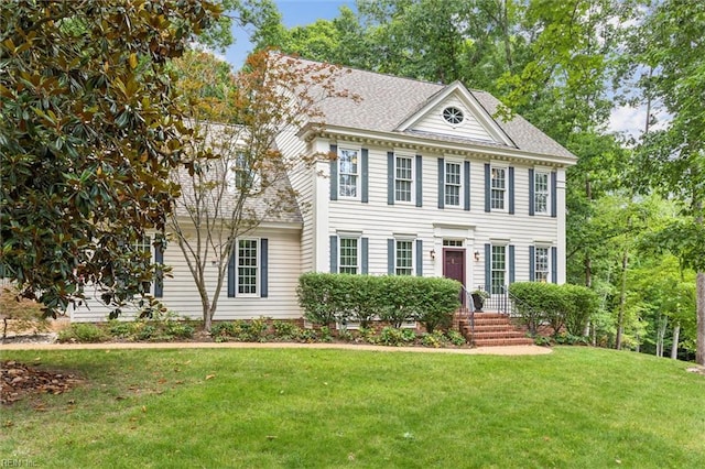 107 Gullane, Williamsburg, VA 23188 - view of front facade featuring a front yard and a shingled roof