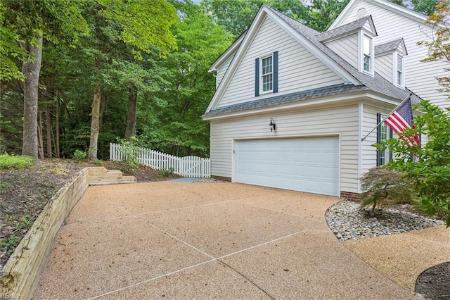 107 Gullane, Williamsburg, VA 23188 - view of property exterior with a shingled roof and concrete driveway