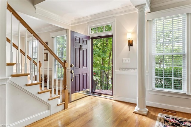 107 Gullane, Williamsburg, VA 23188 - entryway with decorative columns, crown molding, wood finished floors, baseboards, and stairway