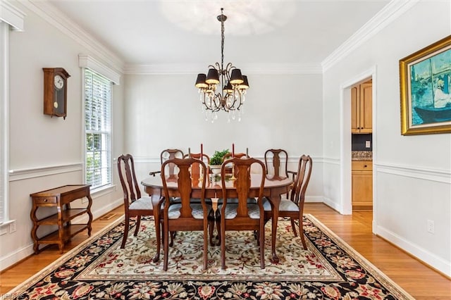 107 Gullane, Williamsburg, VA 23188 - dining space featuring light wood-type flooring, crown molding, a chandelier, and baseboards