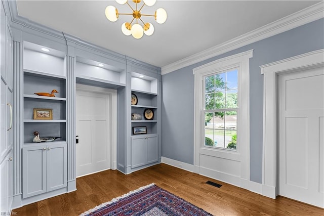 2652 Benefit Rd, Chesapeake, VA 23322 - interior space with ornamental molding, dark wood-style floors, a chandelier, and built in features