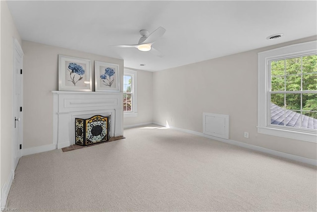 2652 Benefit Rd, Chesapeake, VA 23322 - unfurnished living room with carpet, ceiling fan, and a fireplace with flush hearth