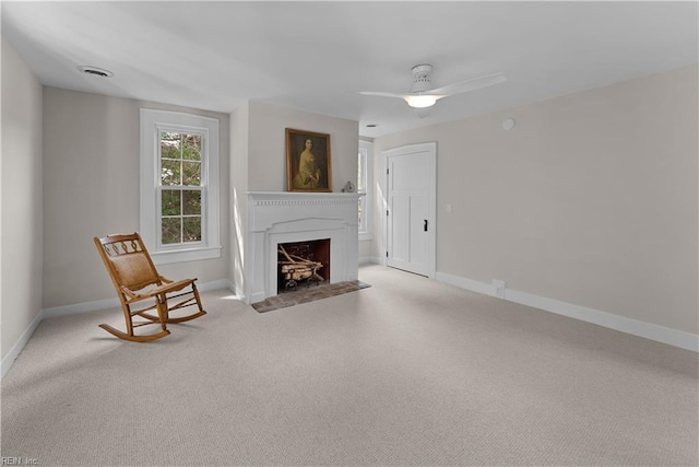 2652 Benefit Rd, Chesapeake, VA 23322 - unfurnished living room featuring light colored carpet, a fireplace with flush hearth, and ceiling fan