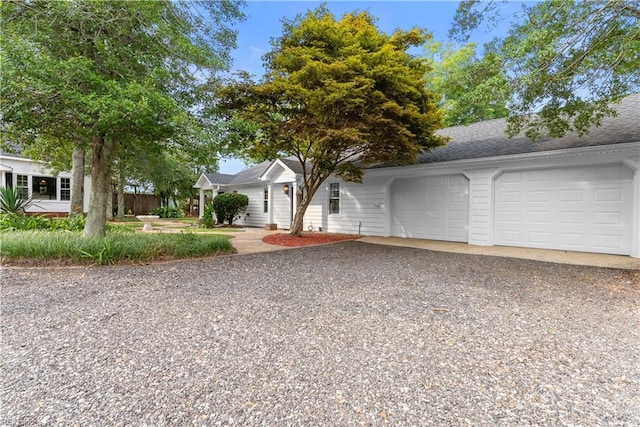 2652 Benefit Rd, Chesapeake, VA 23322 - view of front facade with gravel driveway, a garage, and roof with shingles