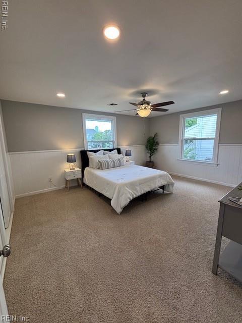913 B St, Virginia Beach, VA 23451 - carpeted bedroom featuring wainscoting, multiple windows, a ceiling fan, and recessed lighting
