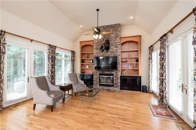 5225 Regatta Pointe Rd, Suffolk, VA 23435 - living area featuring lofted ceiling, light wood-type flooring, a fireplace, and a ceiling fan