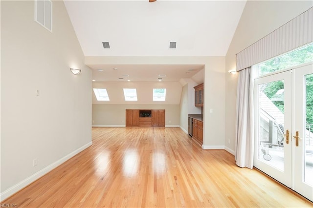 5225 Regatta Pointe Rd, Suffolk, VA 23435 - unfurnished living room featuring high vaulted ceiling, light wood-type flooring, and baseboards