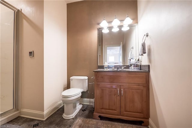 5225 Regatta Pointe Rd, Suffolk, VA 23435 - bathroom with vanity, toilet, baseboards, and a stall shower