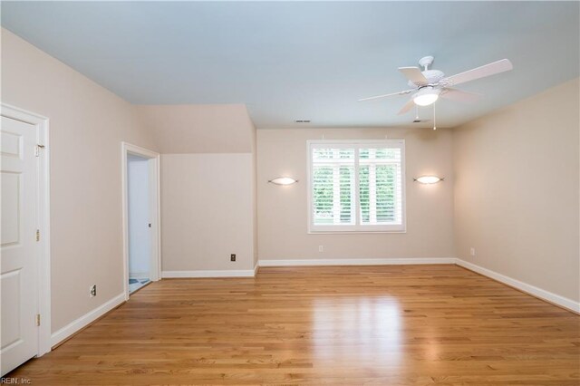 5225 Regatta Pointe Rd, Suffolk, VA 23435 - empty room with a ceiling fan, light wood finished floors, and baseboards